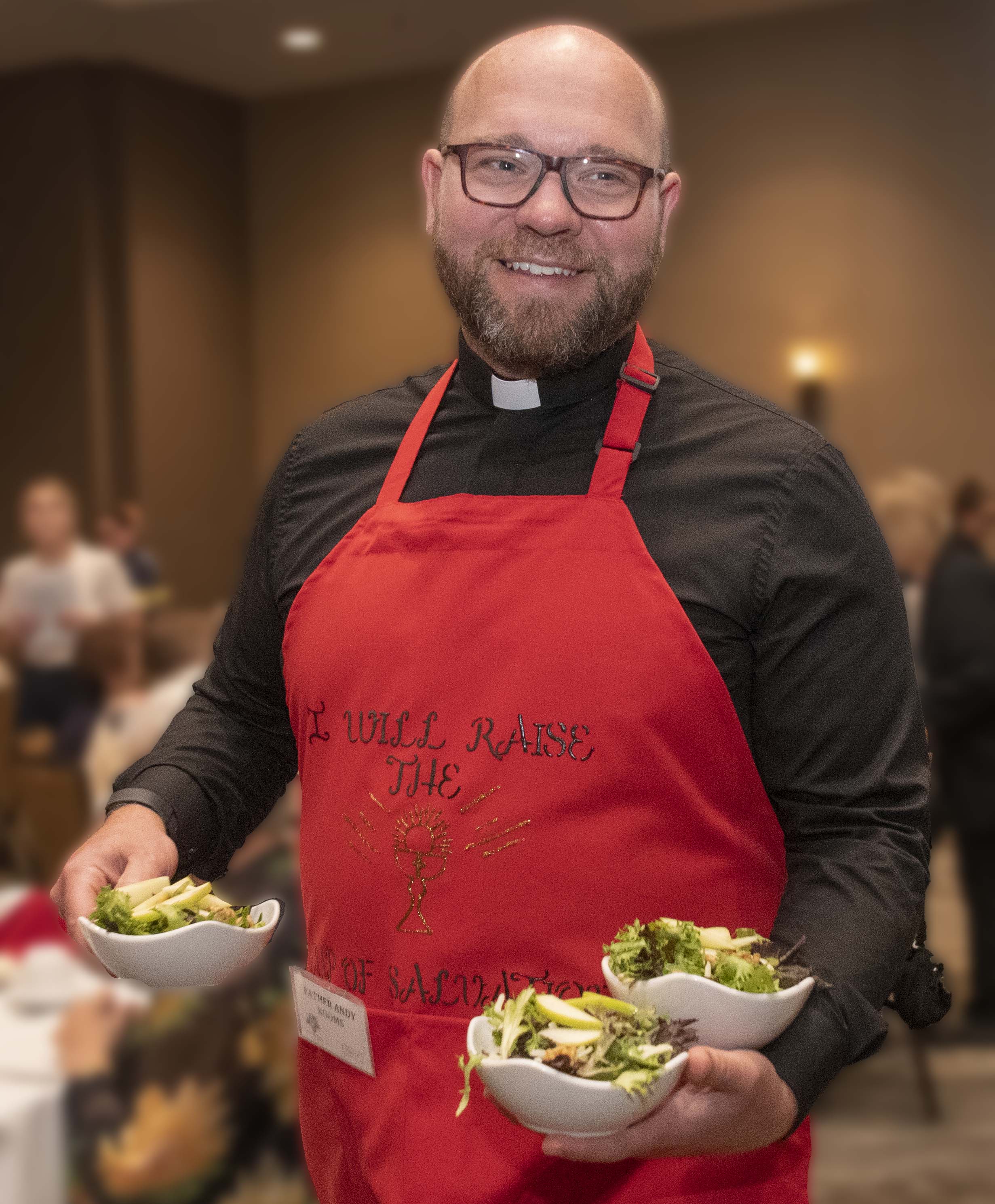 Fr. Booms Serving Salad
