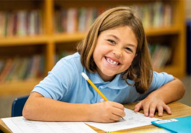 Catholic school girl writing