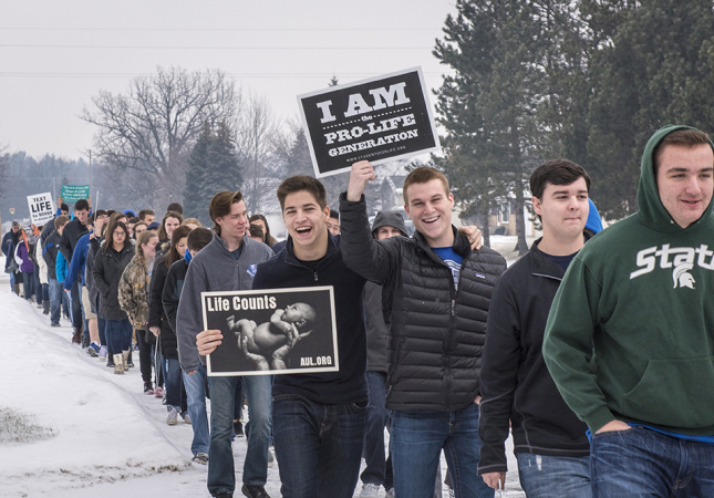 Nouvel students hold mini-March for Life, donate food