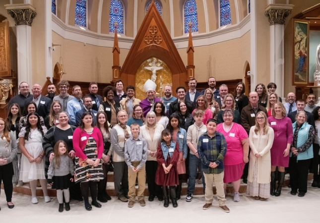 Catechumens and candidates pose for a photo with Bishop Gruss at the Rite of Election and Call to Continuing Conversion in Saginaw on Feb. 18, 2024
