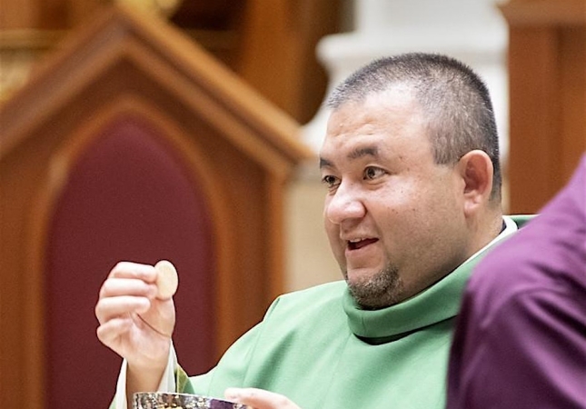 Fr. Jose with Eucharist