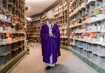 Pope Francis walks through Rome's Prima Porta cemetery