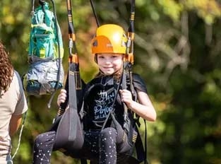 Girl on swing at 5th grade retreat