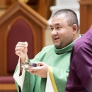 Fr. Jose with Eucharist