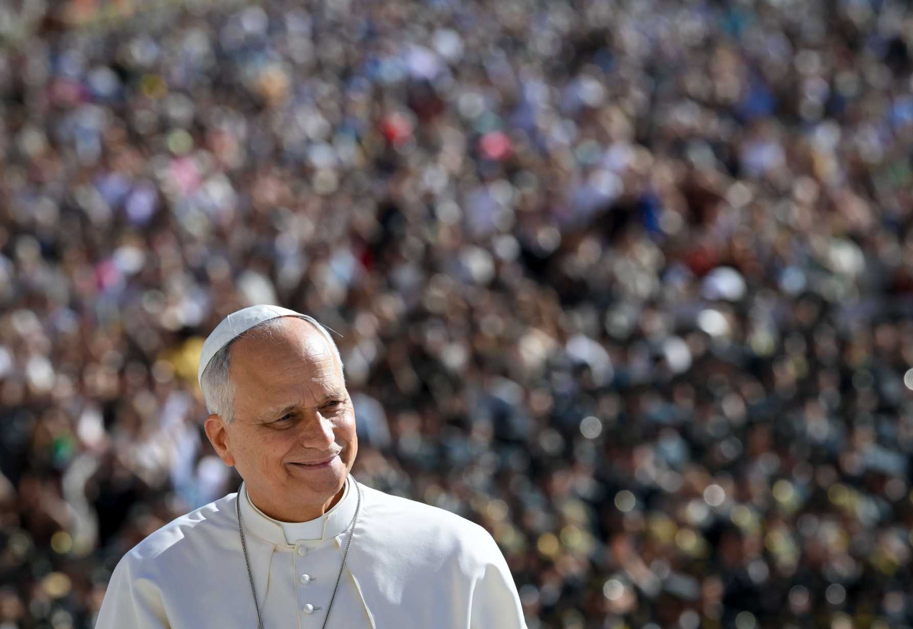 Pope Leo XIV smiles from the popemobile 