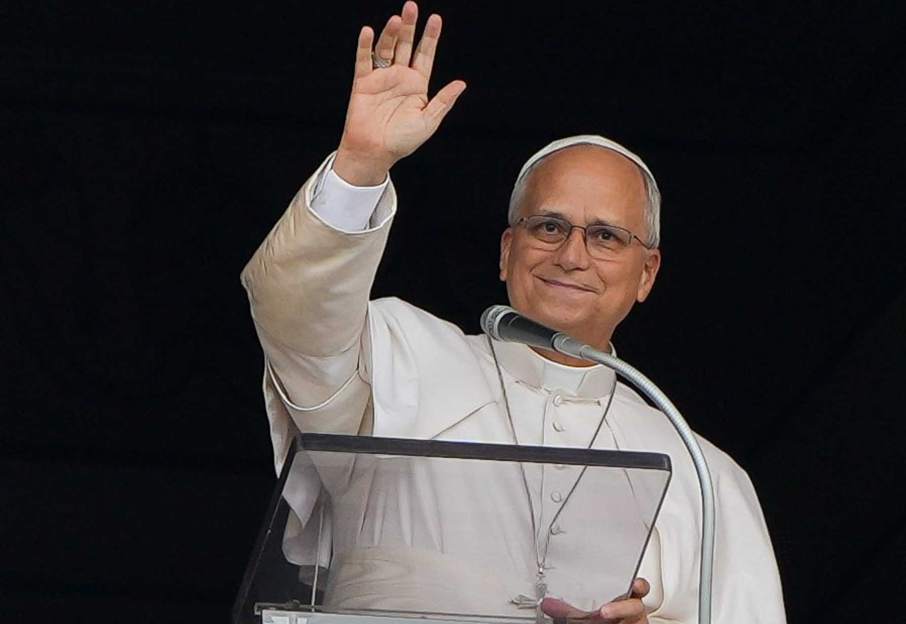 Pope Leo XIV smiles and waves to the faithful