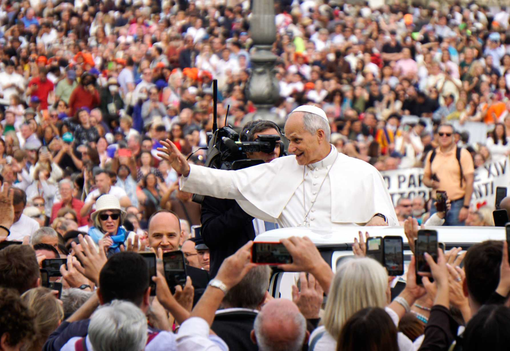Pope Leo XIV greets visitors and pilgrims from the popemobile