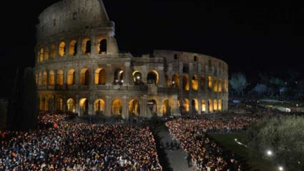 An estimated 20,000 people attend the Way of the Cross service at Rome's Colosseum Good Friday, April 7, 2023. The Vatican announced Pope Francis would not attend the event as planned because of the cold.
