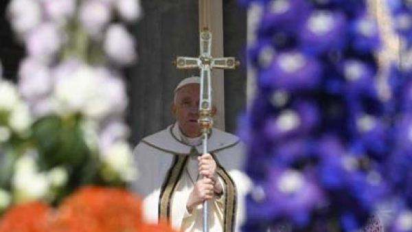 Pope Francis, holding his crosier, celebrates Easter morning Mass in St. Peter's Square at the Vatican April 9, 2023