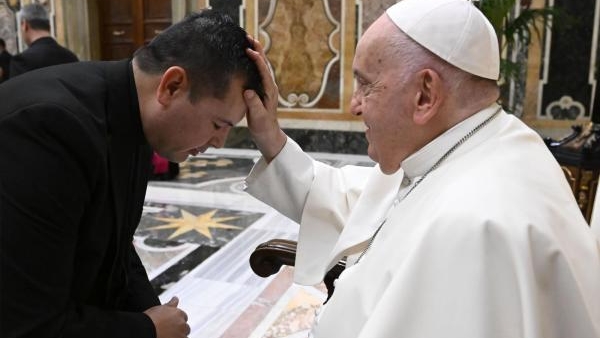 Pope Francis blesses a member of the National Association of Hispanic Priests