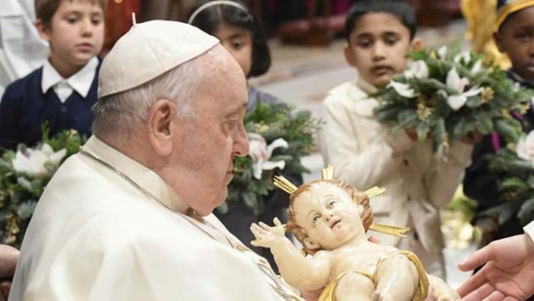 Pope Francis receives a statue of the baby Jesus