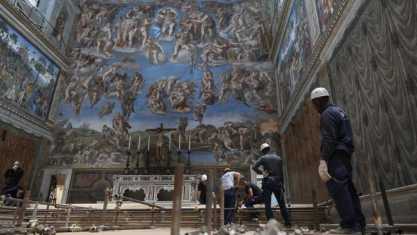 n preparation for the conclave to elect a new pope, workers build platforms over a protective covering on the marble floor of the Sistine Chapel at the Vatican May 2, 2025. 