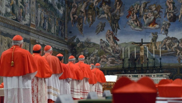 Cardinals from around the world line up in the Vatican's Sistine Chapel March 12, 2013, to take their oaths at the beginning of the conclave to elect a successor to Pope Benedict XVI. 