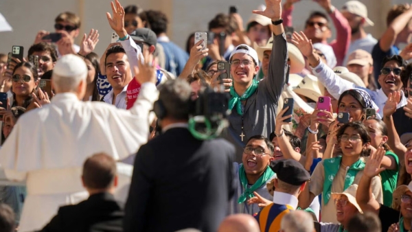 Pope Leo XIV greets visitors and pilgrims from the popemobile