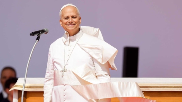 Pope Leo XIV smiles as the wind lifts his mozzetta and fascia at the end of the Jubilee of Youth in Rome’s Tor Vergata neighborhood Aug. 3, 2025