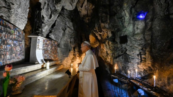 Pope Leo XIV lights a candle and prays in the Cave of St. Benedict at the Shrine of Our Lady of Grace of Mentorella near Guadagnolo, Italy, Aug. 19, 2025