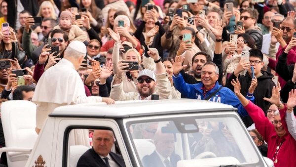 Pope Leo XIV greets visitors and pilgrims from the popemobile