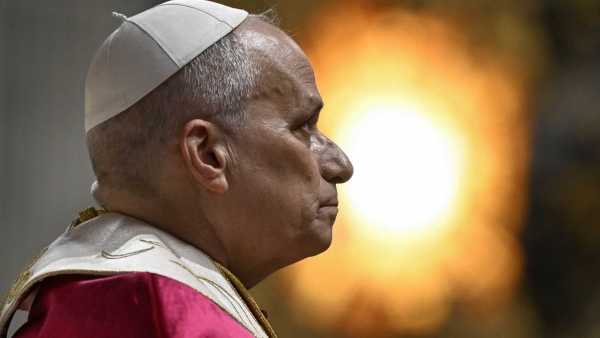 Pope Leo XIV prays during an evening prayer vigil