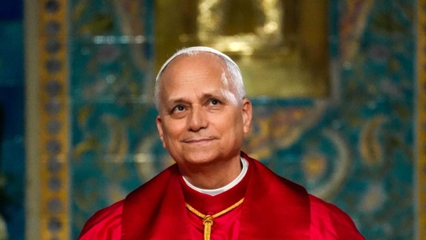 Pope Leo XIV smiles during a meeting 