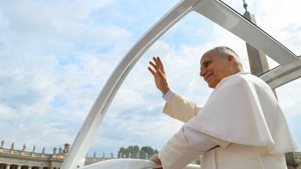 Pope Leo XIV greets visitors and pilgrims from the popemobile